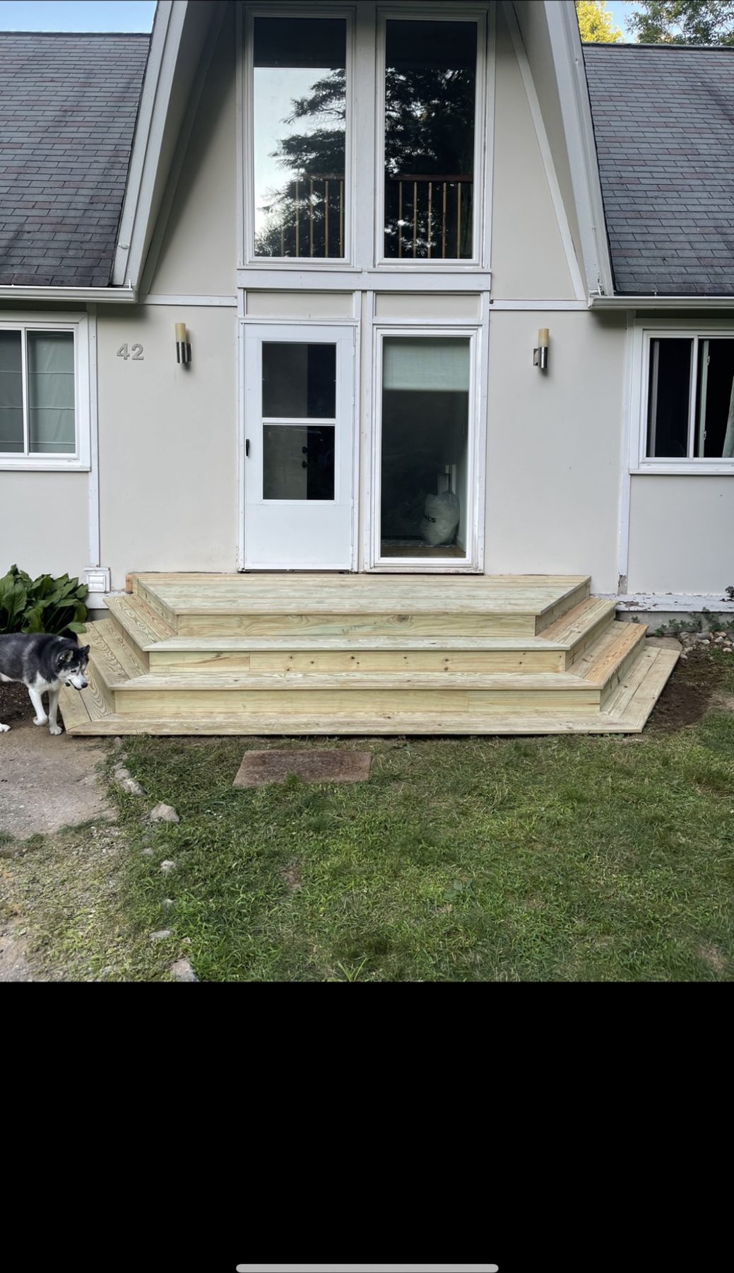 Newly built wooden entry steps and landing on a Connecticut home